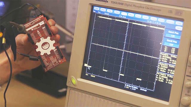 Terry works with MathWorks engineer Greg Wolff to employ C-code generation from Simulink to target a Texas Instruments C-2000 processor. They then program the processor to drive an AC motor provided by Celera Motion.